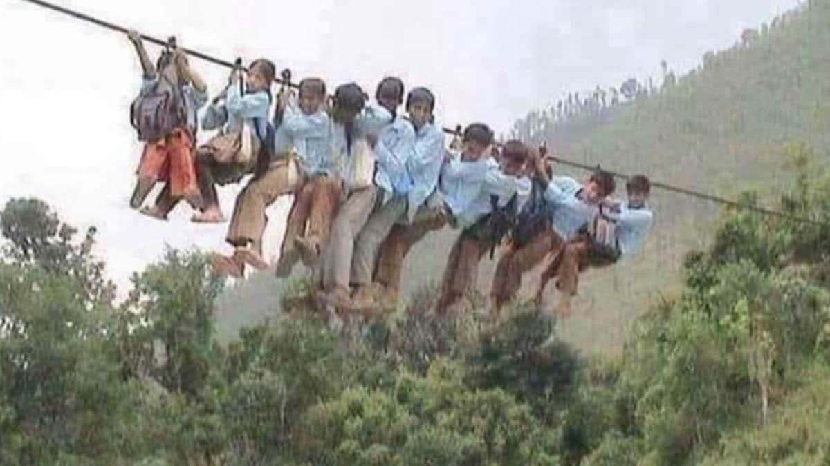 STUDENTS FORCED TO REACH SCHOOL IN MP DIST BY CROSSING RIVER ON ROPES