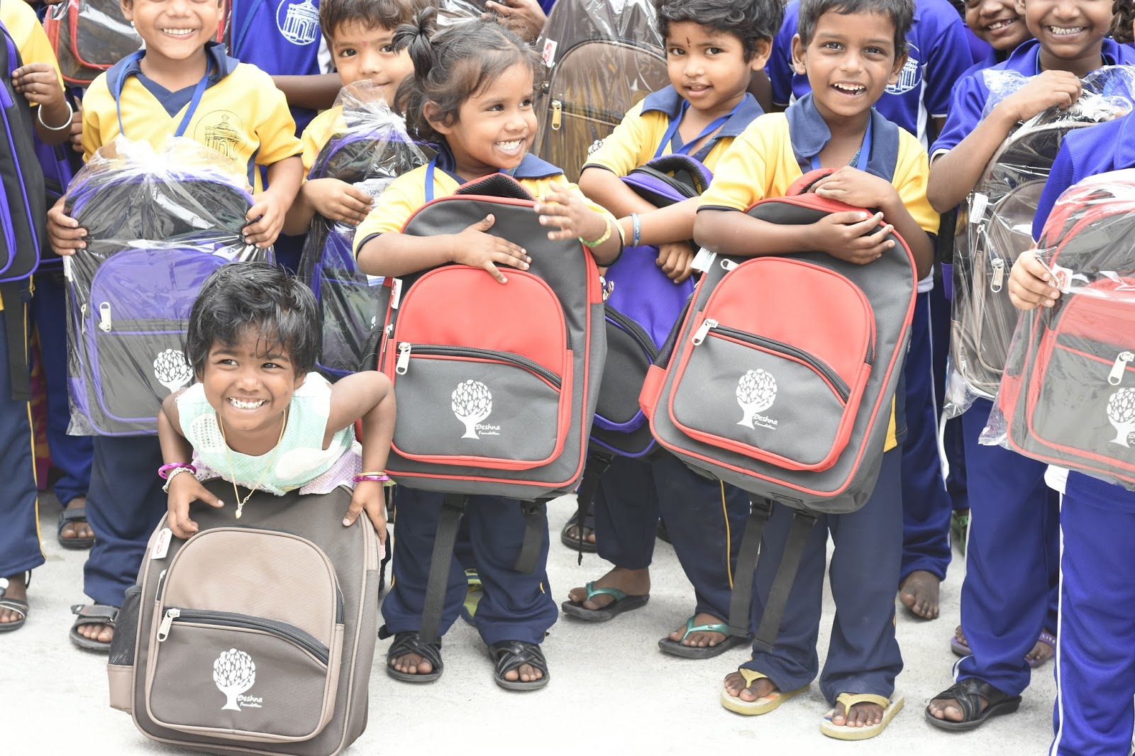 Distribution of bags to students in memory of late Bethi Ramulu