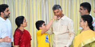 TDP president N. Chandrababu Naidu celebrates his party's victory with family in Amaravati on Tuesday.