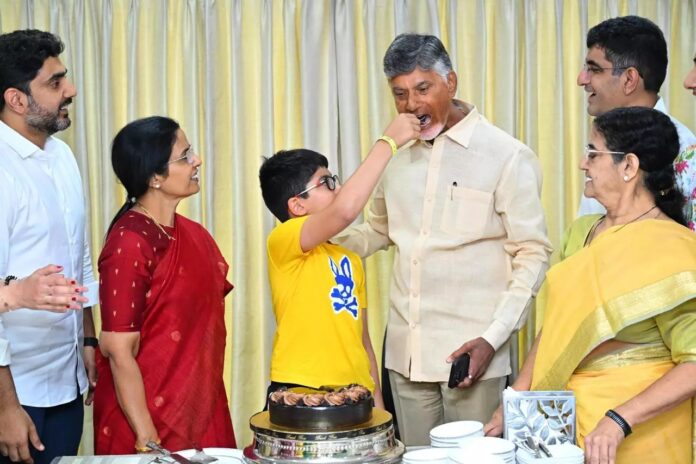 TDP president N. Chandrababu Naidu celebrates his party's victory with family in Amaravati on Tuesday.