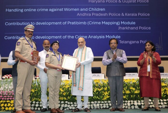 Shikha Goel, IPS, Director of the Telangana Cyber Security Bureau, accompanied by Devender Singh, receives the award from Union Home Minister Amit Shah during the 1st Foundation Day celebration of the Indian Cyber Crime Coordination Centre (I4C) in New Delhi on Tuesday.