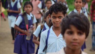Police officers interact with tribal students during a students awareness programme at a Gurukula school in the Future City Commissionerate area.