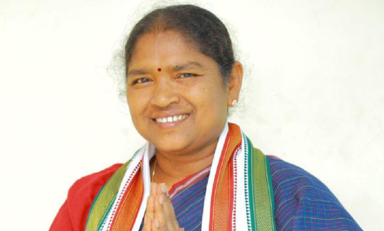 Telangana Minister Seethakka addressing a national financial literacy conference while highlighting women economic empowerment initiatives.