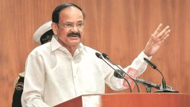 Venkaiah Naidu speaking at Andhra University centenary celebrations with dignitaries and students present