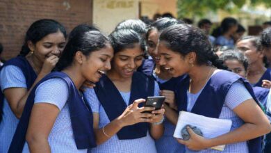 Students checking AP Class 10 results on mobile with happy reactions