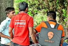 Gig worker receiving a glass of water during extreme Telangana summer heat while working outdoors