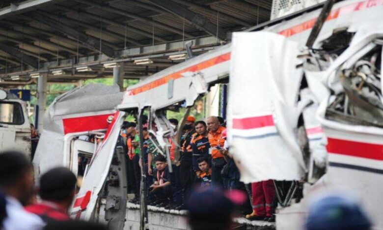 Rescue teams work at the site of a train collision near Jakarta where multiple casualties and injuries were reported