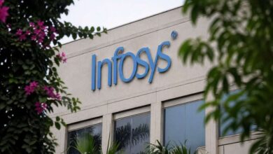 Infosys office building showing tech jobs stability with no layoffs and ongoing hiring plans