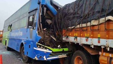 Damaged private bus after collision with truck on NH 65 near Kodad leaving several passengers injured