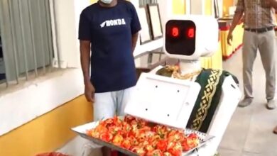 Puducherry elections robot Nila welcomes voters in saree at polling booth offering sweets and interacting to encourage voter participation