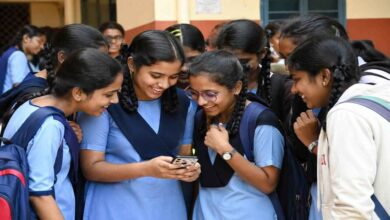 Students checking Telangana Class 10 results on mobile phone after result announcement