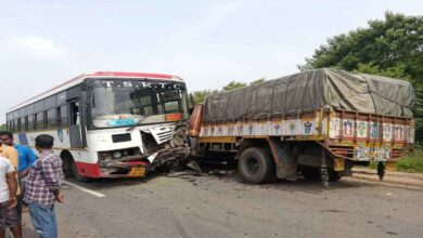 Damaged RTC bus and lorry after collision on Medak highway in Telangana with emergency response at accident site