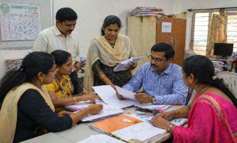 Officials and teachers review documents during discussions on Telangana teacher promotions and mandatory TET qualification rules
