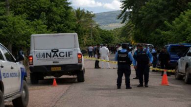 Police officers and security personnel at an investigation site in Honduras following deadly attacks involving police teams and farm workers.