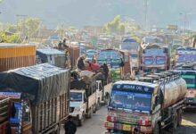 Heavy vehicles undergo load checking at national highway toll plaza under new toll rules