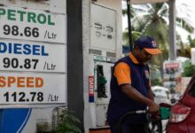 Fuel station worker filling petrol in a vehicle as petrol and diesel prices increase across India amid rising crude oil costs