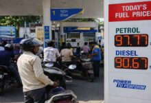 Vehicles lined up at an Indian petrol station after fuel prices increased across the country