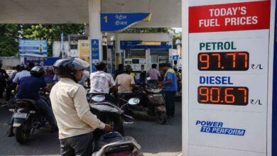 Vehicles lined up at an Indian petrol station after fuel prices increased across the country