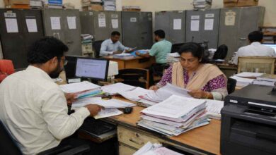 Government employees processing records for Telangana Employee Health Scheme and Employee Health Care Trust implementation