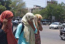 People protect themselves from extreme heat as temperatures rise sharply across Telangana districts during ongoing heatwave conditions