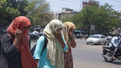 People protect themselves from extreme heat as temperatures rise sharply across Telangana districts during ongoing heatwave conditions