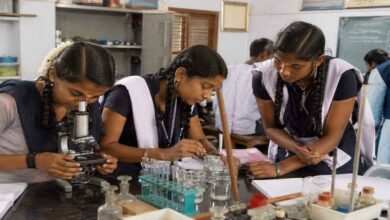 Intermediate students performing science practical experiments in a laboratory under Telangana education reform plans