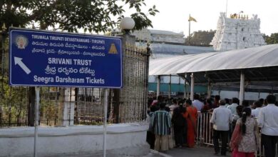 Devotees standing in queue near Srivani Trust ticket counter area at Tirumala amid investigation into online booking irregularities.