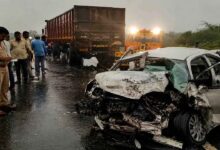 Police and rescue teams inspect a damaged car after a fatal road accident on the Trichy Coimbatore National Highway in Tamil Nadu