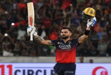 Virat Kohli raises his bat and helmet after scoring a match winning century in RCB’s dominant victory over Kolkata Knight Riders in IPL 2026.