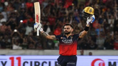 Virat Kohli raises his bat and helmet after scoring a match winning century in RCB’s dominant victory over Kolkata Knight Riders in IPL 2026.