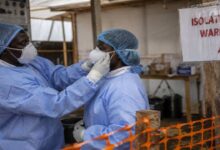 Healthcare workers wearing protective equipment inside an Ebola isolation ward during the outbreak in Africa