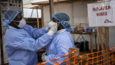 Healthcare workers wearing protective equipment inside an Ebola isolation ward during the outbreak in Africa